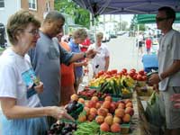 farmer selling produce at market day
